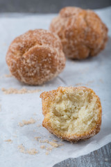 Inside of donut hole rolled in cinnamon sugar 