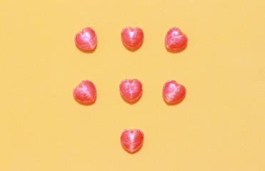 Hearts candy on orange background for valentine