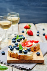 Strawberry and blueberry ricotta sandwiches