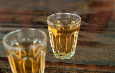 whiskey in a glass  on wood table