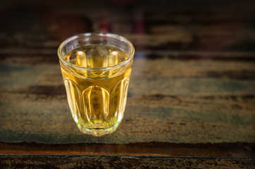 whiskey in a glass  on wood table