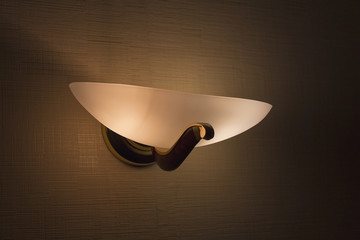 Wall lamp in a bedroom in the shape rook. Interior