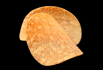 Potato chips on black