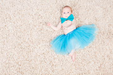 little girl ballerina in blue skirt
