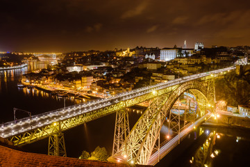 Fototapeta na wymiar Dom Luis I bridge over Douro river illuminated at night, Porto, Portugal
