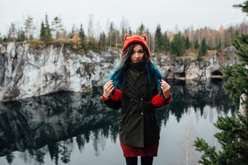 Pretty nice girl enjoy beautiful lake view from the hilltopl and good weather in Karelia. Around the rocks.