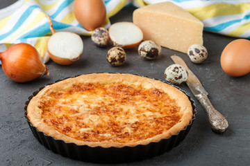 Homemade gourmet pie with cheese, onions and eggs
