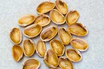 Many pistachio shells next to each other