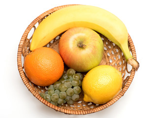 banana, lemon, apple, grapes and orange fruit in straw basket