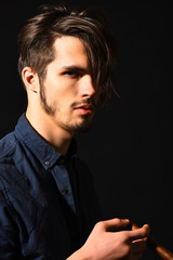 serious bearded man with cigar