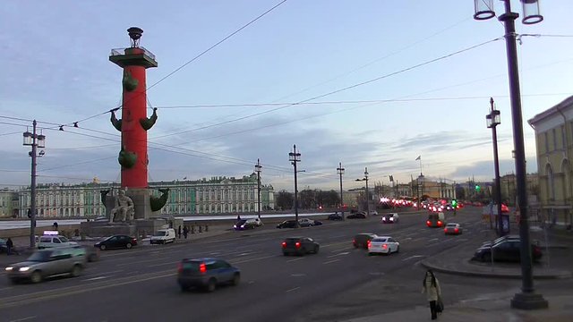 Saint Petersburg, Russia: timelapse of evening intensive traffic of vehicles on the streets. Many cars on spit of Vasilievsky island and Rostralny columns. Life of people of the city.