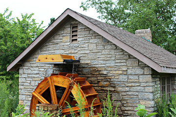 Fototapeta premium Brick building with water wheel