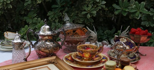 Vintage style tea party in the garden with macaroons and home made cake
