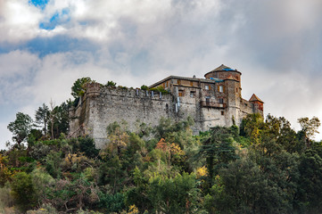 Fototapeta na wymiar Old medieval castle, located on a hill near harbor of Portofino town, Italy