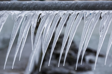 Icicles on a fence after a winter storm on Lake Geneva.