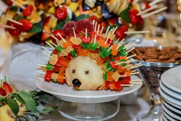 composition of fruits carving, hedgehog of pears. © simonnamoya
