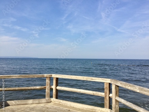 "Steg mit Holzgeländer am Wasser" Stock photo and royalty-free images