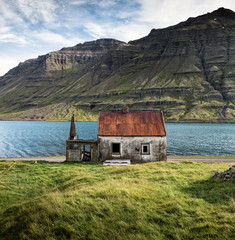 Lakeside abandoned house in Seydisfjordur, Eastern Iceland
