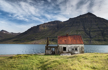 Lakeside abandoned house in Seydisfjordur, Eastern Iceland