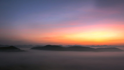 Soft focus sunrise at mist on the mountain