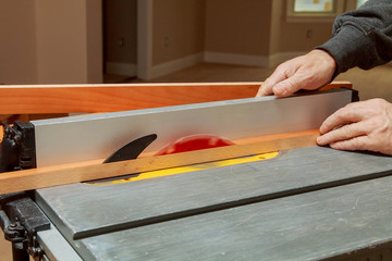 carpenter works on woodworking the machine tool.  working   machines in carpentry shop.