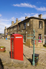 Red English Telephone Box and Terrace Houses in Haworth, North Yorkshire