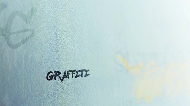  Graffiti Tag Signature on dreary suburban outside wall