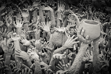 Hands from hell at Wat Rong Khun. Chiangrai province, Thailand. Filter effect style 