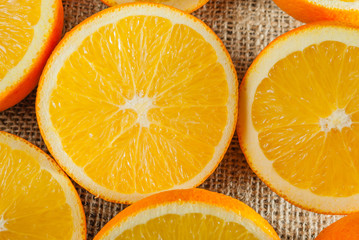Oranges Fruits and Orange Slice on Wooden Table and Retro Fabric