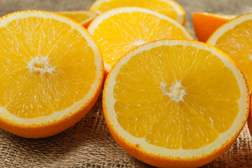 Oranges Fruits and Orange Slice on Wooden Table and Retro Fabric