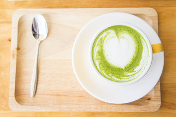 hot green tea milk cup and coffee cup and strawberry cake