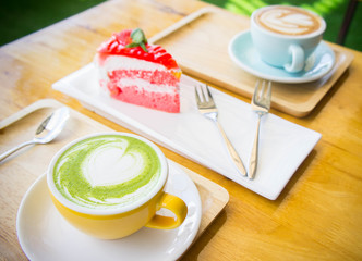 hot green tea milk cup and coffee cup and strawberry cake