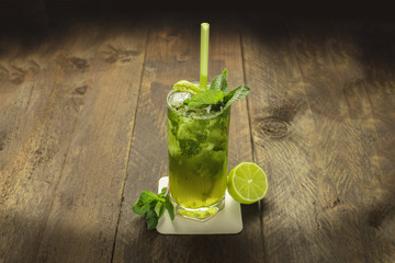 Mojito cocktail with mint leaves and lime