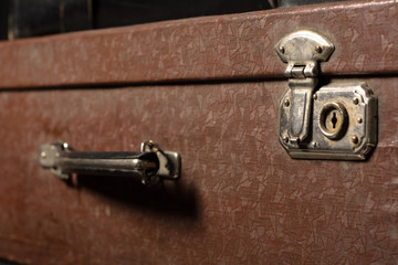 Obraz na płótnie Canvas Close-up of a suitcase. Iron Castle vintage bag