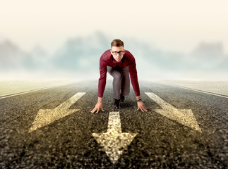 Businessman kneeling in ready position