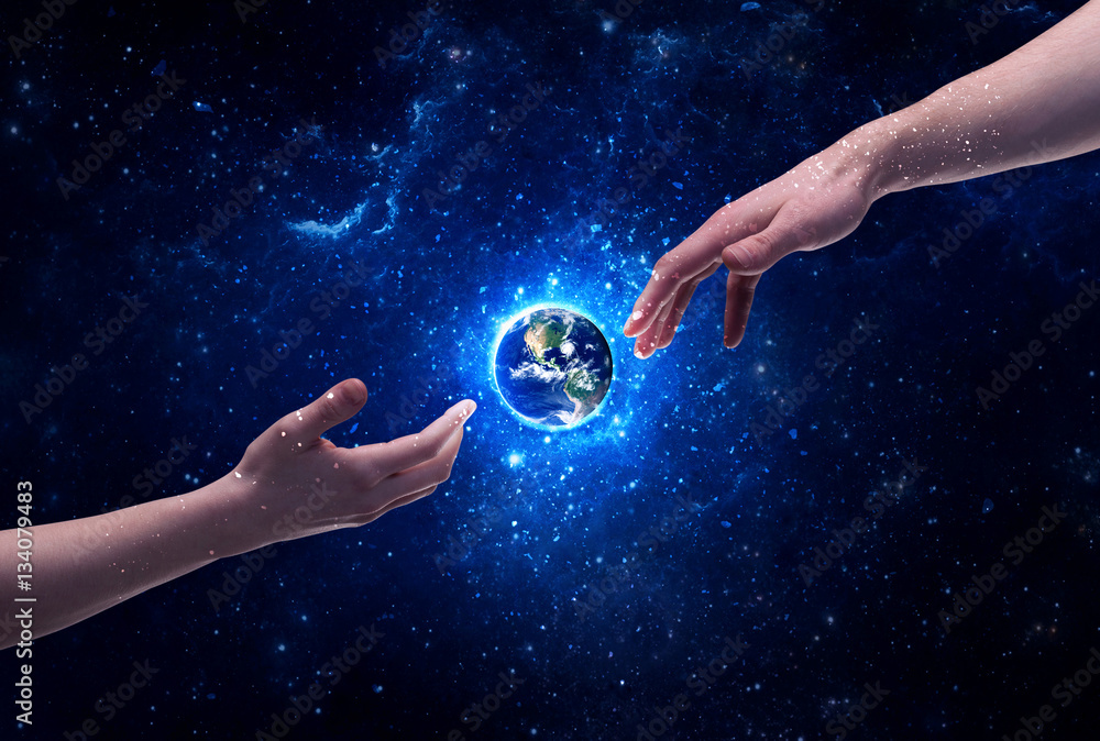 Wall mural hands in space touching planet earth