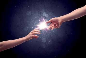 Hands reaching to light a spark