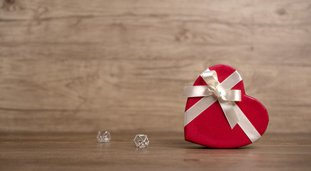 Gift box on the wooden background. Valentine's Day gift. Red box