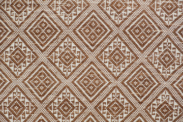 old colorful thai handcraft peruvian style rug surface old vintage torn conservation Made from natural materials Chemical free close up.