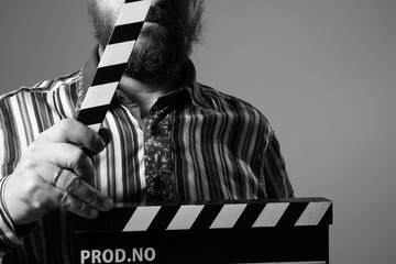 Close-up of a man clapperboard cinema