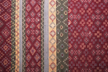 colorful thai silk handcraft peruvian style rug surface old vintage torn conservation Made from natural materials Chemical free close up silk background silk texture