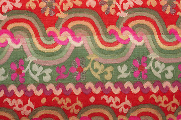 colorful thai silk handcraft peruvian style rug surface old vintage torn conservation Made from natural materials Chemical free close up silk background silk texture