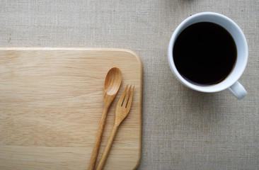 Empty plate with spoon fork and coffee cup