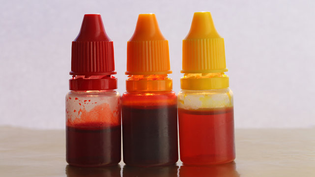 yellow, orange, red  liquid food colorings