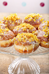 Traditional Polish homemade donuts with rose liqueur and orange