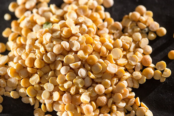 yellow peas on a black background