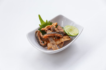 Crispy Fried Salmon Skin Served with Lime.