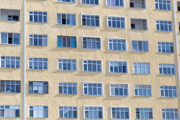 Fototapeta na wymiar windows of a multistory building as background