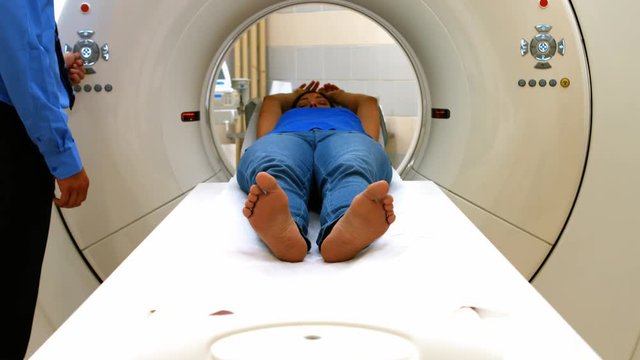 A patient is loaded into an mri machine