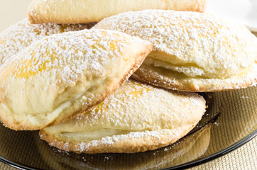 Fresh cakes with sweet filling sprinkled